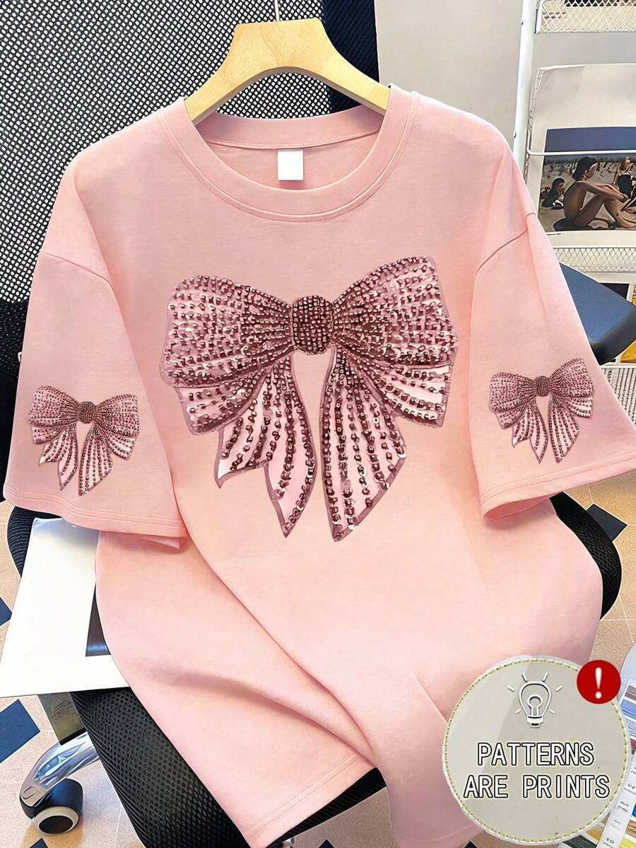 蝴蝶结印花T恤，大码女式上衣，时尚印花短袖设计。适合夏季度假、海滩、圣诞节、母亲节礼物；适合日常穿着、海滩、健身、女士夏季服装、女士节日装扮。 - 粉色 - 查看 1