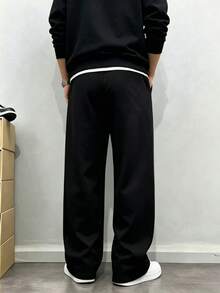 男士休闲运动裤，宽松直筒版型，垂坠感好，适合居家休闲和户外活动。也可作为情侣礼物赠送。采用100%涤纶面料，配有抽绳腰带，可调节松紧，多种颜色可选。 - 黑色 - 查看 2