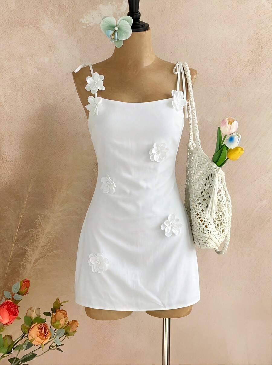 Temptaria Đầm ngắn nữ với dây đeo mảnh có thể điều chỉnh, dây buộc vai và họa tiết hoa thêu - Hoàn hảo cho kỳ nghỉ biển, lễ hội âm nhạc, dạo chơi công viên, những chuyến đi chơi cuối tuần và những chuyến mua sắm. Màu trắng thanh lịch. - trắng - Xem 1