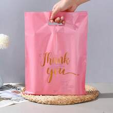 20入/50入/100入粉色透明禮品袋，金色「Thank You」印字星形設計，時尚優雅，適合節日、生日派對或婚禮伴手禮，4種尺寸 S/M/L/XL 可選，搭配精美禮物更能表達誠意 - 彩色 - 查看 1
