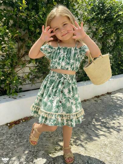 2pcs/Set Young Girls' Summer New Tropical Plant All-Over Print Camisole Top With Bow Decor + Tassel Button A-Line Mini Skirt Suit, Suitable For Beach Vacation