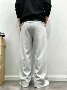 Men's Casual Sweatpants, Loose Straight-Leg Fit, Comfortable Drape, Suitable For Lounging And Outdoor Activities. Also Makes A Great Couples Gift. Made Of 100% Polyester Fabric With Drawstring Waistband For Adjustable Fit, Available In Multiple Colors. - Light Grey - View 2