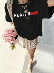 Nueva llegada 2026: camiseta de manga corta con cuello redondo para mujer. Hecho de 100% algodón puro con un corte holgado. Diseño casual y versátil con estampados, una prenda esencial en el armario. Perfecto para el transporte diario, citas informales y moda urbana. - Negro - Ver 8