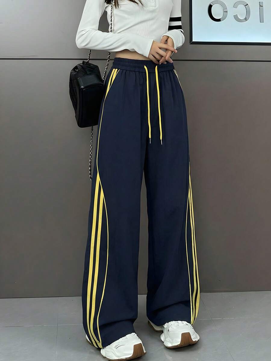Pantalones anchos de pierna ancha con rayas laterales, cintura con cordón y bolsillos, en color azul marino y amarillo, de tejido suelto, apropiados para primavera, verano, otoño y uso casual - 0B67 Azul marino y amarillo - Ver 1