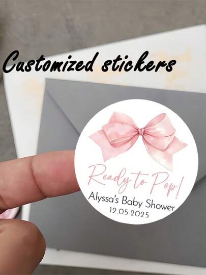 Nhãn dán tròn cá nhân hóa dành cho tiệc mừng em bé, với hình nơ hồng và dòng chữ "Ready To Pop" (Sẵn sàng chào đời) | Hoàn hảo để trang trí tiệc, dán lên quà tặng và làm biển hiệu sự kiện.