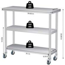 Mesa de trabajo utilitaria de 3 niveles de acero inoxidable – Estación de preparación duradera para exteriores e interiores con estante de almacenamiento – Mesa auxiliar comercial para patio, restaurante, cocina, garaje – Varios tamaños – Con ruedas bloqueables - Mesa de almacenamiento (3 niveles, con ruedas) - Ver 7