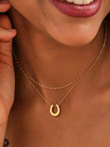 1. Dây chuyền mặt hình móng ngựa bằng thép không gỉ mạ vàng 18K\N2. Dây chuyền mặt hình học có thể tháo rời\N3. Dây chuyền ôm sát cổ hình móng ngựa chữ U mạ vàng cổ điển\N4. Dây chuyền kẹp giấy tối giản\N5. Dây chuyền mặt hình móng ngựa phong cách Boho\N6. Dây chuyền xương đòn bùa may mắn nhỏ nhắn\NQuà tặng trang sức thời trang dành cho nữ - Vàng - Xem 2