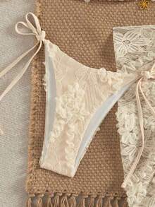 Swim Mod Conjunto de 3 piezas, traje de baño sexy para mujer con sujetador triangular halter con textura floral y decoración dorada, braguitas de bikini con lazos laterales y falda pareo.Conjunto de bikini de 3 piezas con top de encaje, pareo de encaje y cobertura de playa.Conjunto de bikini con top de cuentas, concha y cobertura para vacaciones y festivales. - Multicolor 3 - Ver 6