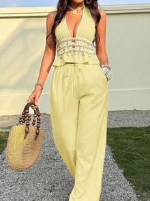 Conjunto de dos piezas con top halter de cuello en V profundo y textura arrugada en color albaricoque, y pantalones rectos de cintura baja.Conjunto de mujer para primavera/verano, vacaciones, playa, estilo bohemio minimalista, elegante y vintage, de uso versátil. - Amarillo - Ver 7