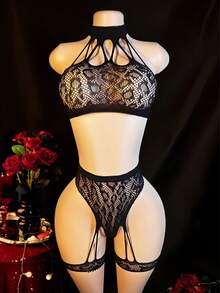 2 piezas Conjunto de lencería de encaje para mujer con portaligas - Sujetador y tanga de malla transparente con estampado de leopardo, ropa de dormir sexy - Negro - Ver 1