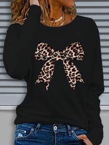 Camiseta de manga larga suelta de moda para mujeres con diseño de arco con estampado de leopardo y cuello redondo, de moda y elegante. Hecho de tela ligeramente elástica, adecuado para usar en todas las estaciones. Pesa 180G por metro cuadrado - Negro - Ver 2