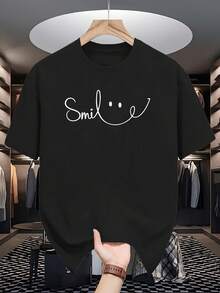 Camiseta con Estampado de SONRISA para Hombre y Mujer - Suave y Transpirable, con Estampado de Cara Feliz Blanca y Letras de Sonrisa, Cuello Redondo Casual, Manga Corta, Corte Regular, Comodidad para Todas las Temporadas, Ropa Casual Unisex, Lavable a Máquina, Idea de Regalo para Hombres y Mujeres, Estampado de Cara Feliz Blanca, Versátil para Atuendos Casuales y Formales, Estilo Retro y Moderno, Cómoda para Todo Tipo de Cuerpo, Camisetas Divertidas para Hombres, Camisetas para Mujeres - Camiseta Vintage de Estilo Urbano Unisex, Holgada, de Algodón, Manga Corta y Cuello Redondo - Negro - Ver 1