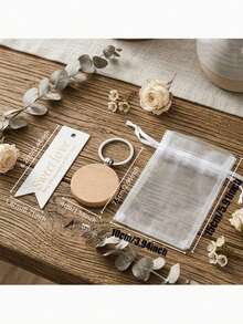 15件套男女款结婚礼物钥匙扣套装，包含木质钥匙扣、卡片和薄纱袋，适合作为婚礼宾客回礼、新郎新娘手工婚礼纪念品、婚礼庆典、新娘送礼会礼物。 - 均碼 - 查看 10