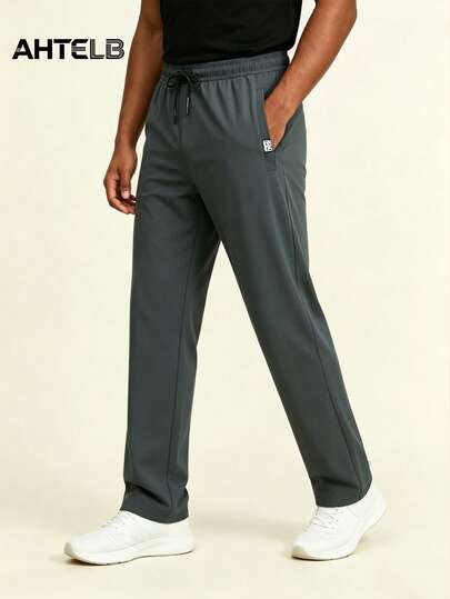 AHTELB Pantalon de jogging léger en soie de glace respirante et élastique pour hommes avec poches zippées et cordon de serrage à la taille. Tissu doux et confortable en soie de glace. Pantalon droit de couleur unie absorbant la transpiration. Convient pour un usage décontracté, extérieur, entraînement, vacances, pêche, tenue de gym.