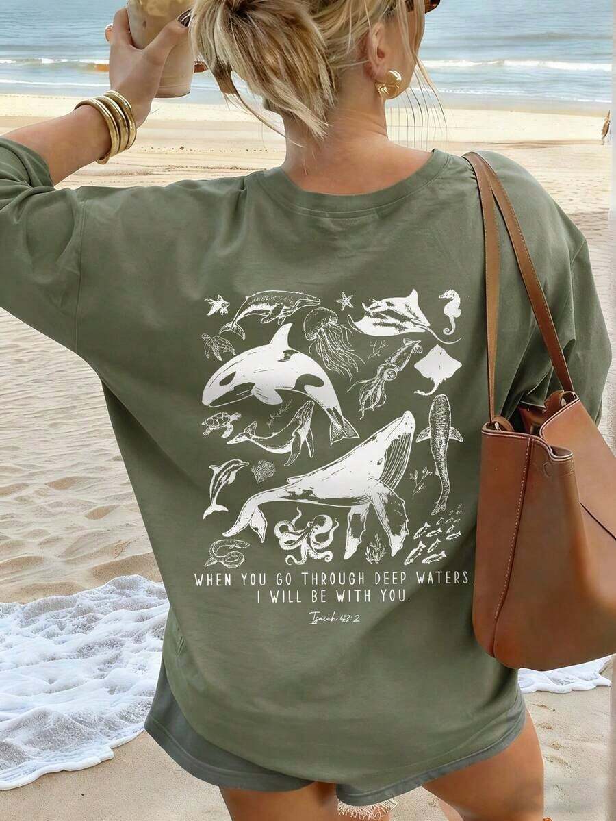 Women's Summer Short-Sleeved T-Shirt With A Casual Marine Animal Print Featuring Sharks, Dolphins, And Starfish. It Has A Round Neck, A Loose And Versatile Fit, And Is Beige In Color. Ideal For Everyday Wear And Vacations. Unisex. - 草綠色 - 查看 1