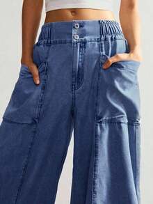 Versátiles y modernos, estos jeans cargo de pierna ancha combinan el estilo urbano con la comodidad que necesitas.El corte holgado favorece cualquier tipo de figura, mientras que los bolsillos laterales le dan un toque práctico y streetwear.El lavado claro es ideal para combinar con tops cortos, camisetas o sudaderas. - Azul lavado medio - Ver 12