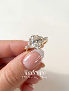 MADEONE 1 chiếc nhẫn bạc 925 Sterling 4 chấu hình bầu dục đính đá Cubic Zirconia, kiểu dáng thanh lịch châu Âu dành cho nữ, tinh tế và độc đáo, thích hợp cho các buổi dạ hội, họp mặt và tiệc tùng, một món quà tuyệt vời. - Nhẫn hình bầu dục lấp lánh - Xem 3
