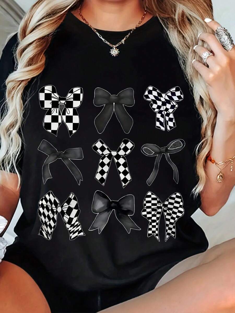 [Plus Size Short Sleeve T-Shirt] Black Plus Size Tee Featuring Unique Black and White Checkered Bow Designs in Symmetrical Pattern, Stylish and Trendy, Perfect for Casual Outings, Comfortable Fit, Great for Layering, Eye-Catching Graphic Design, Ideal for Fashion Lovers