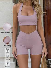 Bộ đồ thể thao nữ mùa hè màu trơn Aoqta Sports gồm hai mảnh: áo tank top không tay kiểu racerback có đệm ngực và quần short cạp chéo ôm bụng, phù hợp cho yoga, chạy bộ, tập luyện và mặc hàng ngày. - Màu tím - Xem 4