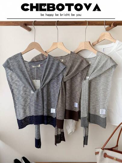 1 chiếc áo khoác cardigan nữ kẻ sọc, áo sơ mi cài cúc phía trước phối màu tương phản, khăn choàng vai dùng trong phòng điều hòa văn phòng.