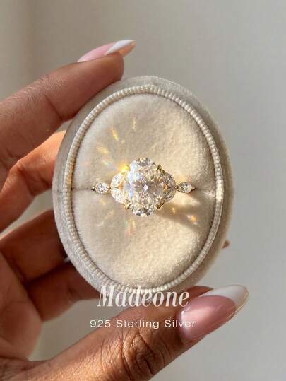 MADEONE 1 chiếc nhẫn bạc 925 Sterling 4 chấu hình bầu dục đính đá Cubic Zirconia, kiểu dáng thanh lịch châu Âu dành cho nữ, tinh tế và độc đáo, thích hợp cho các buổi dạ hội, họp mặt và tiệc tùng, một món quà tuyệt vời.