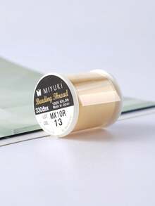 55 thước Anh (khoảng 137 mét) chỉ Nhật Bản, 100% nylon, 330 DTEX, dây thun 0.225mm, thích hợp để tự làm vòng tay. - Tuyến JP - Xem 6