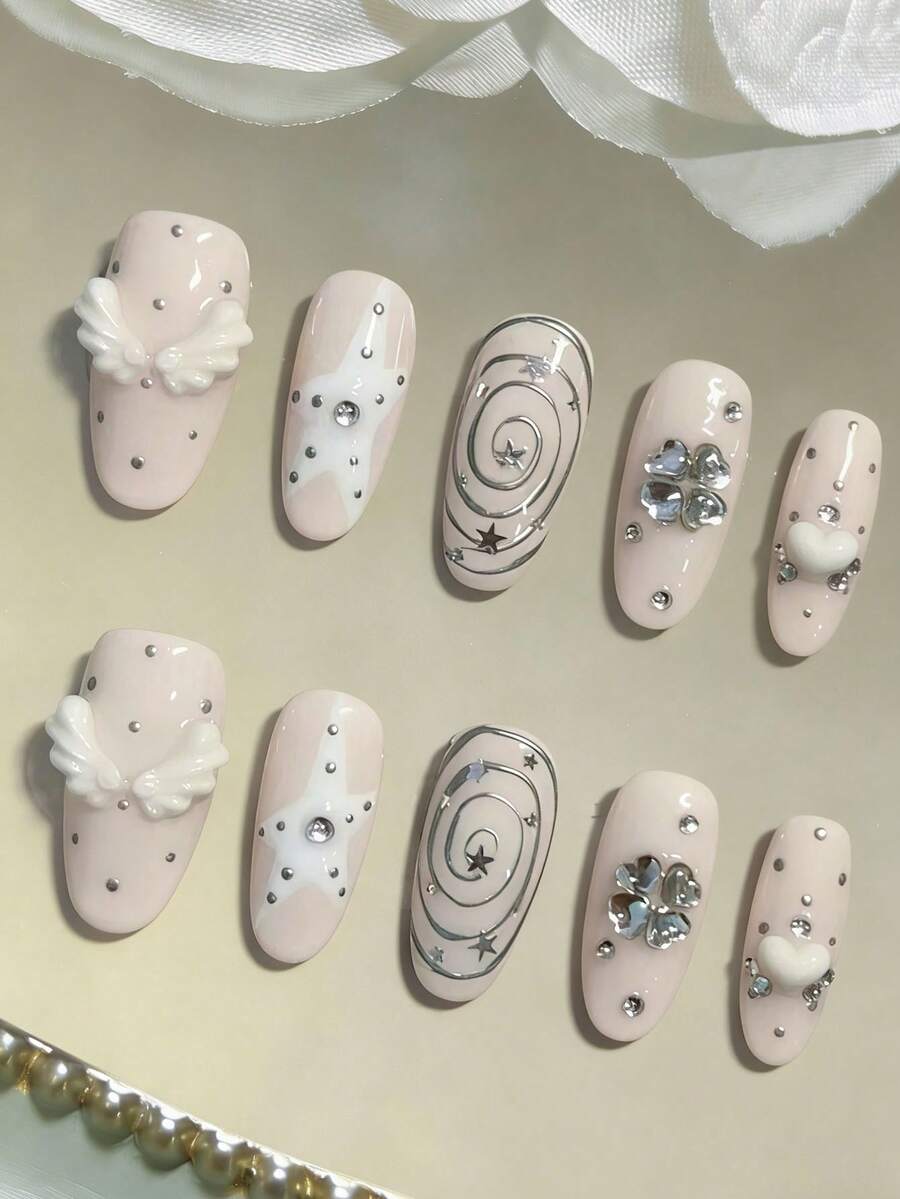 10 miếng dán móng tay thủ công kiểu Y2K hình bầu dục, độ dài trung bình, nền hồng pastel với sao trắng, viền bạc, cánh trắng 3D, phụ kiện trang trí móng hình trái tim đính đá bạc. - Nhiều màu - Xem 1