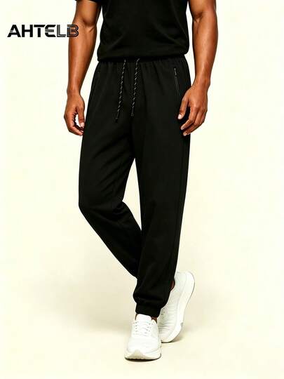  AHTELB Men's Summer Casual Sweatpants With Side Letter Print, Drawstring Waist, Ankle-Tied, Anti-Theft Zipper Design, Soft & Breathable Ice Silk Fabric, Solid Color Sporty Pants, Suitable For Gym, Outdoor Activities And Running