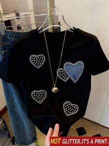 Camiseta básica de manga corta para mujer Otoño/Invierno 2025: cuello redondo, corte holgado, estampado de corazones de moda, tejido suave con caída impecable y ultra combinable - Negro 2 - Ver 2