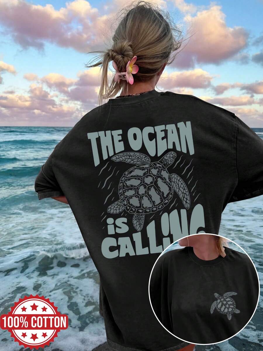 Reversible Printed T-Shirt For Women, Perfect For Spring And Summer. A Versatile And Stylish Top With A Vintage Design Featuring Sea Turtles And Ocean Elements. This Crew Neck, Short-Sleeved, Oversized T-Shirt Features The Slogan 'THE OCEAN IS CALLING'.
