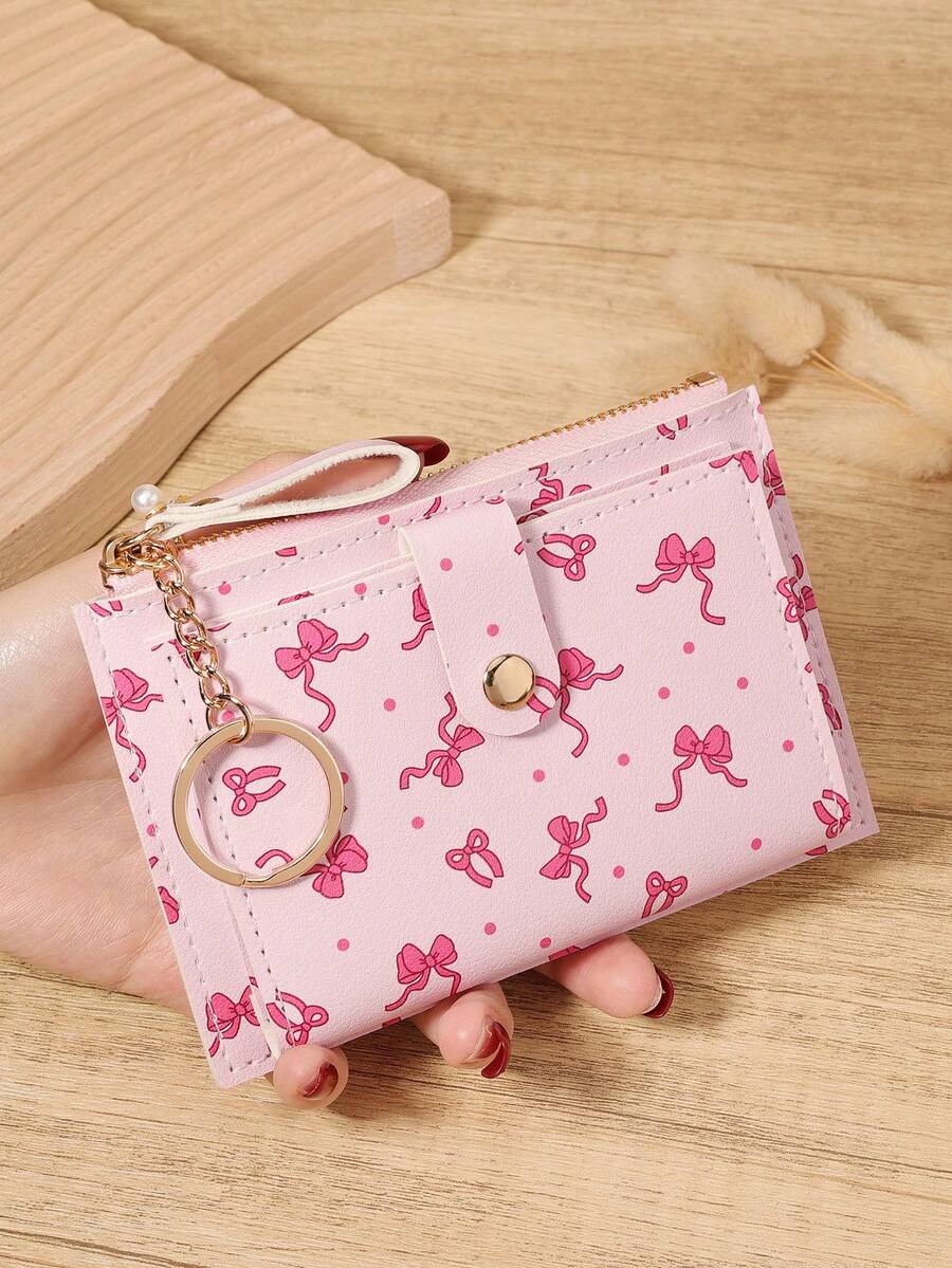 Portefeuille pliable mignon à imprimé nœud rose rouge, avec fermeture éclair tout autour et porte-clés en chaîne, fentes pour cartes multiples + poche à pièces + fenêtre d'identification, compact et unisexe pour un usage quotidien, les voyages et les achats, accessoire kawaii pour cadeau d'anniversaire