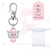 Bộ 30 móc khóa thiên thần bao gồm 10 móc khóa thiên thần, 10 túi quà Eugen Sand và 10 thiệp cảm ơn có nhãn dán dành cho khách mời dự tiệc sinh nhật (màu hồng). - Xem 3