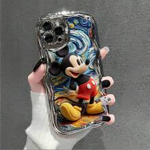 Officially Licensed Disney Mickey Mouse Phone Case, This Protective Phone Case Features A Classic Print Of Cheerful Mickey Mouse With His Iconic Round Ears And Bright Smile, Set Against A Vibrant Backdrop Decorated With Subtle Star And Polka Dot Accents, Made With Flexible, Durable TPU Material To Protect Against Everyday Scratches, Bumps, And Minor Impacts, With A Raised Camera Frame For Extra Lens Protection, Slim And Lightweight Construction That Adds Minimal Bulk And Fits Easily In Pockets And Bags, Compatible With IPhone 17, 16, 15, 14, 13, 12, 11 Pro Models, Making It A Timeless Choice For Mickey Fans And Disney Lovers, Ideal For Birthdays, Holidays, Or Any Special Occasion To Surprise Family And Friends - 銀色 - 查看 2