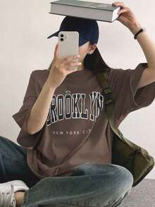 Camiseta holgada para mujer con estampado de letras, camiseta oversize, camisetas gráficas para Pascua.Y2K style,Fashionable styel,2026 newest,cute style,Causal style.180g(S-XXXL)) - Marrón - Ver 2
