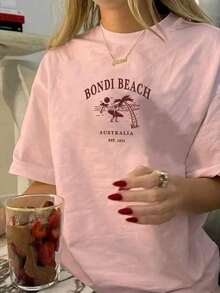 Women's Summer Short-Sleeve T-Shirt, Casual And Loose Fit, With An Australian Bondi Beach Print, Perfect For Everyday Wear And Street Style. Casual Summer Street Style Tops For Women, Cute Beach T-Shirts, Summer Tops For Women, Summer Going-Out Tops. - 羅莎 - 查看 5