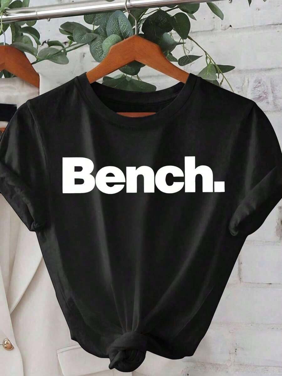 1 Pieza Moda Informal Para Hombres Y Camiseta de Mujer de manga corta minimalista moderno de Banco para mujer, primavera/verano - Blanca con gráfico es negro "Banco" camiseta de cuello redondo casual y cómoda para mujer, adecuada para primavera, verano, otoño, uso casual al aire Versátil, fácil de combinar, adecuado para el uso diario, estilo urbano, conjuntos de vacaciones, conjuntos de fin de semana. - Negro - Ver 1