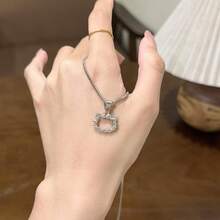 1 chiếc vòng cổ mặt dây chuyền hình nơ Hello Kitty dễ thương của Sanrio, món quà ngọt ngào và đáng yêu dành cho bạn thân. - A - Xem 10