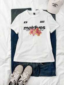 Camiseta de manga corta con cuello redondo y corte ajustado para mujer, estampada con letras y motivos florales tropicales. Cuello redondo clásico y sencillo, fácil de combinar y se adapta a todas las formas del cuerpo. Perfecto para citas, desplazamientos diarios y salidas informales. - Blanco - Ver 4