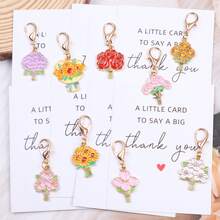 9 pezzi Set regalo elegante e romantico di portachiavi a tema floreale, include girasole, rosa, margherita, tulipano e altri portachiavi floreali alla moda. Include anche un sacchetto regalo e una cartolina a tema gratitudine. Adatto per feste di compleanno, feste all'aperto, lauree, feste in giardino, bomboniere per matrimoni, per uomini e donne - Multicolore - Visualizzare 12
