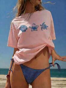 Camiseta de manga corta azul claro para mujer, estilo casual, holgada, con cuello redondo, estampado de letras, animales marinos, caparazón de tortuga y flores, ideal para uso diario y vacaciones. - Rosa - Ver 7