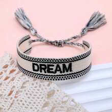 1条绣有“DREAM”字母的手工编织休闲可调节手链，适合派对和日常佩戴。 - 黑與白 - 查看 4