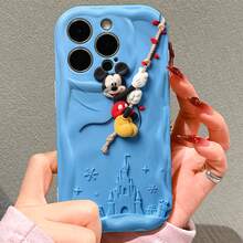 Disney Mickey Mouse Phone Case, Official Mickey Character Design, Mickey Climbing A Rope With Christmas Lights In Soft Plush Texture On A Light Blue Background With Castle And Snowflake Details Protective Cover. Compatible With IPhone 17, 16, 15, 14, 13, 12, 11 Pro Series, Featuring A Festive, Winter-Themed Mickey Mouse, Perfect For Mickey Fans And Disney Lovers During The Holiday Season, Ideal For Christmas Gifts, Birthdays, Holidays, Anniversaries, Or Any Special Occasion To Surprise Family, Friends, Classmates, And Loved Ones. - trắng - Xem 2