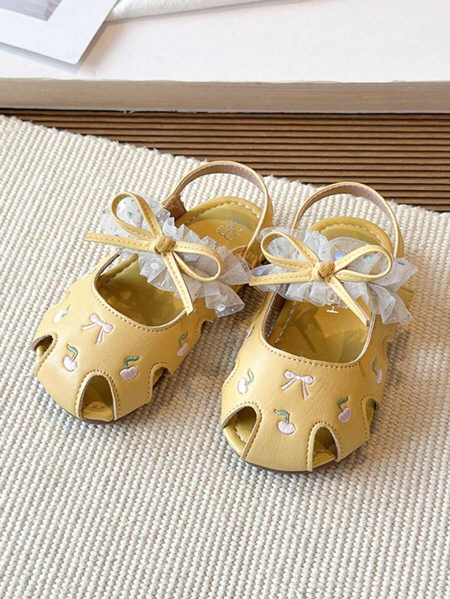 Sandal ren nơ cho bé gái, sandal mùa hè chống trơn trượt đế mềm có khóa dán cho bé. - Màu vàng - Xem 1