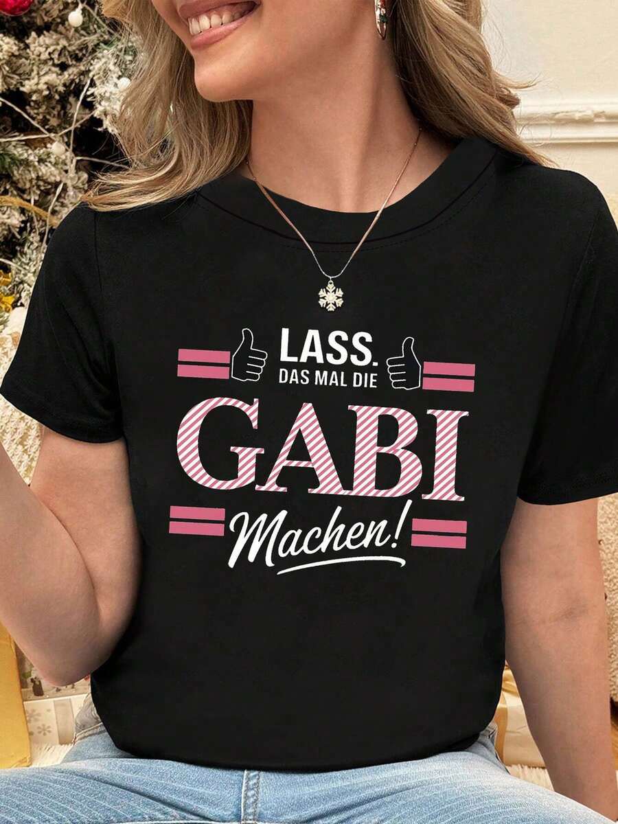 Diseño Sencillo y Versátil: "El Momento de Confianza de Gabi" en alemán: "LASS DAS MAL DIE GABI Machen!" Camiseta de Algodón para Mujer con Estampado de Gesto de Pulgar Arriba, Cuello Redondo, Estilo Casual, para Primavera y Verano. - Negro - Ver 1