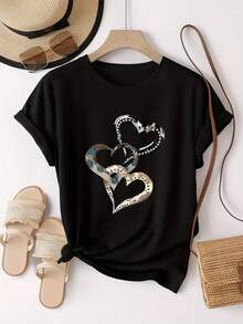 El epítome de "emoción y amor", esta camiseta de manga corta para mujer presenta un estampado de corazón metálico, moderno y a la moda, con un cuello redondo sencillo y un diseño casual versátil, adecuada para el ocio, viajes, vacaciones y otras actividades. - Negro - Ver 5