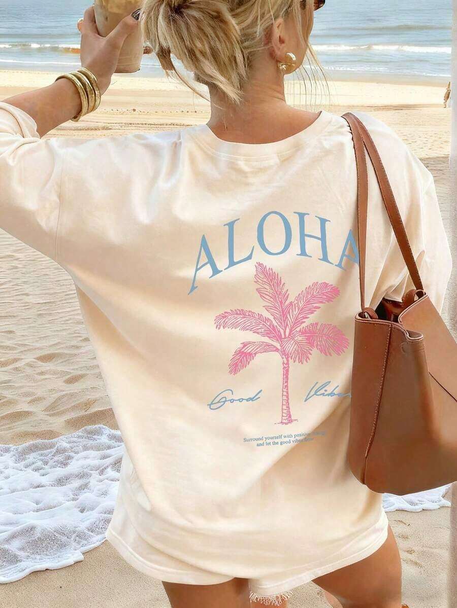 Women's Loose-Fitting Cotton T-Shirt With A Round Neck In Light Pink, Featuring A Palm Tree Print And The Text "ALOHA" On The Back, In A Casual Hawaiian Vacation Style. - 杏色 - 查看 1