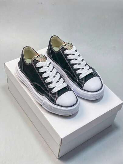Zapatillas de diseñador de la colaboración MMY, clásicas de suela disuelta en blanco y negro, zapatos de lona de estética antideslizante y duradera, esenciales para parejas en el campus, primavera 2026