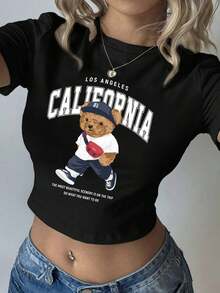 Women's Fitted Crop Top With A Round Neck, Short Sleeves, And A Youthful California-Style Bear Print. A Super , Minimalist Design. Ideal For Back To School And Everyday Wear In Summer. Made From A Cool And Very Comfortable Fabric. Looks Great For Going Out, Meetings, And Casual Looks. Easy To Pair With Jeans And Shorts. A Favorite Among Young Women. 8337 - 黑色 - 查看 7