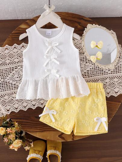 2pcs Baby Girl Summer Casual Set: White Sleeveless Lace Hem Top With Bow Accent And Yellow Jacquard Shorts With Bow Decor