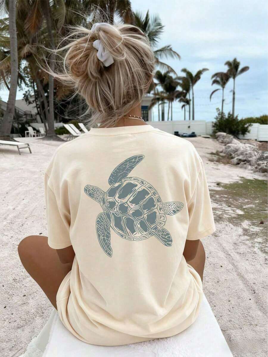 Camiseta de manga corta con cuello redondo y corte regular, estilo casual y con estampado de tortuga marina para mujer. - Albaricoque - Ver 1